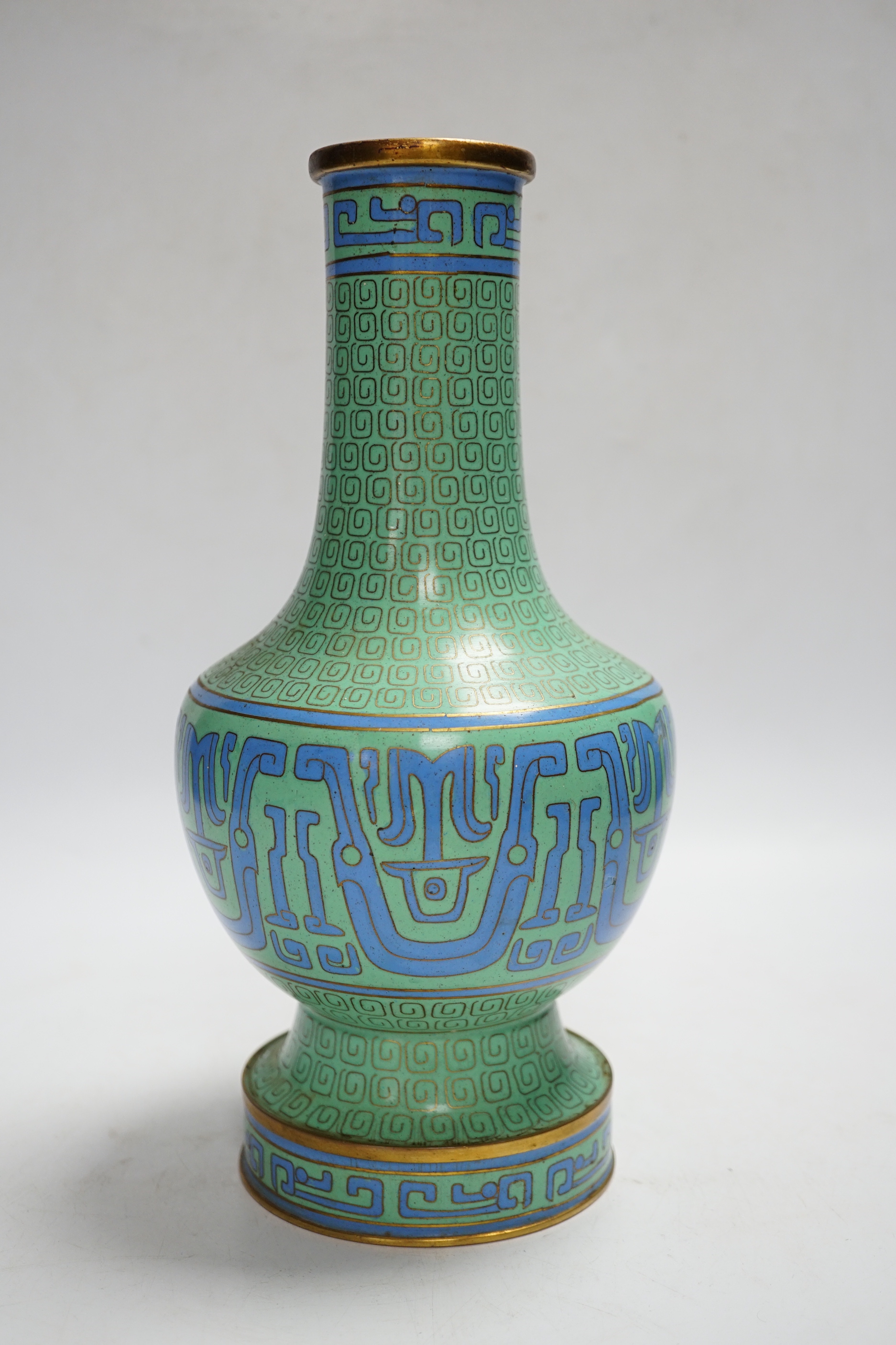 A Chinese green cloisonné enamel vase, hole to base, 27cm high
